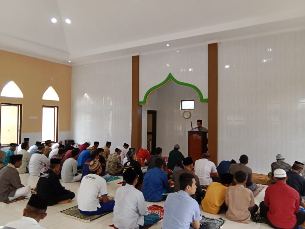 Worshippers gather inside the mosque prayer hall.