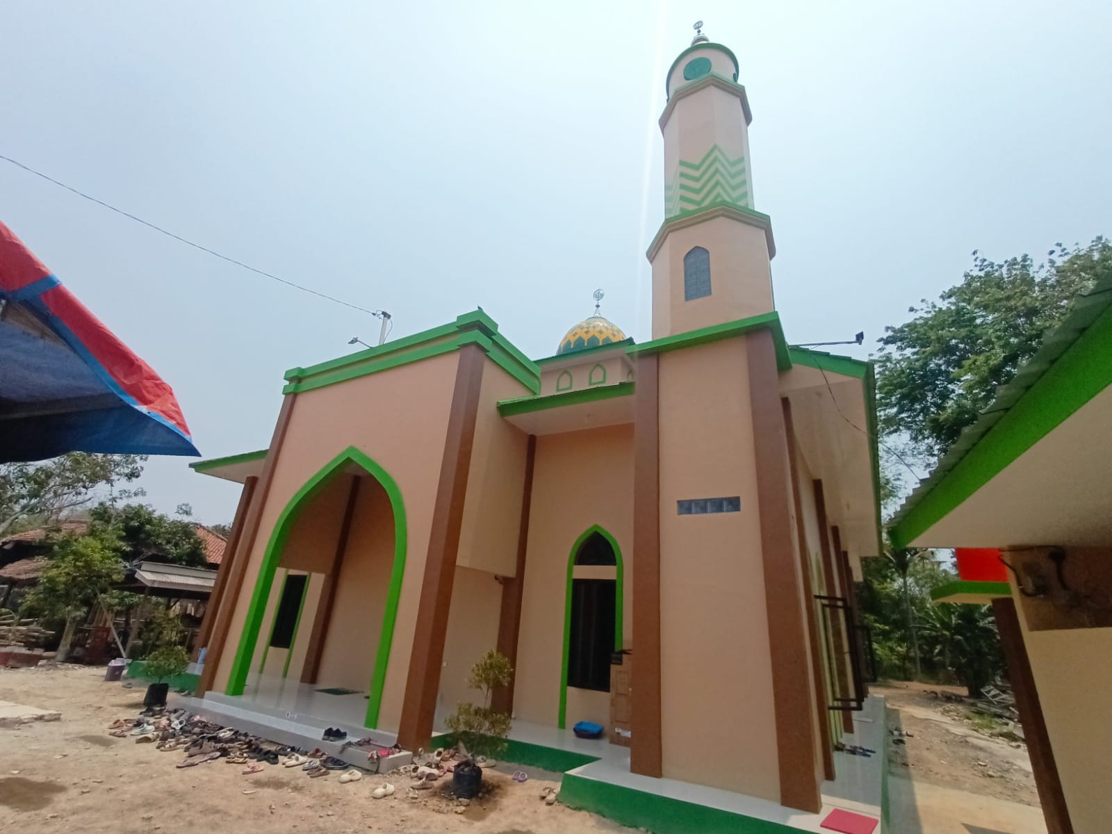 Exterior of the mosque, showing its entrance and windows.