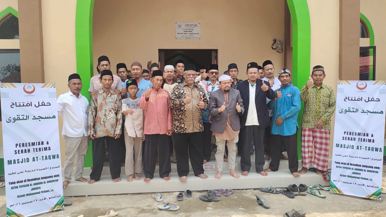 Participants pose together at the mosque entrance.
