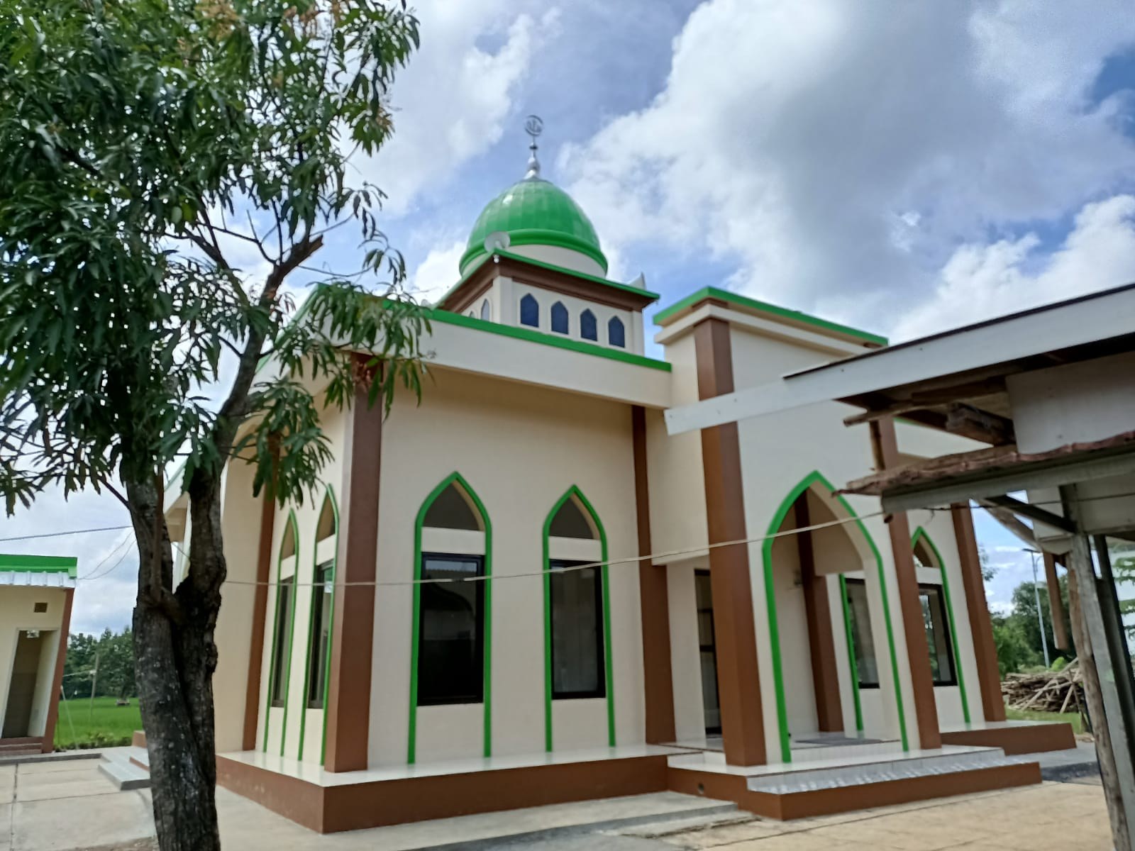 Exterior of the mosque, showing its entrance and windows.