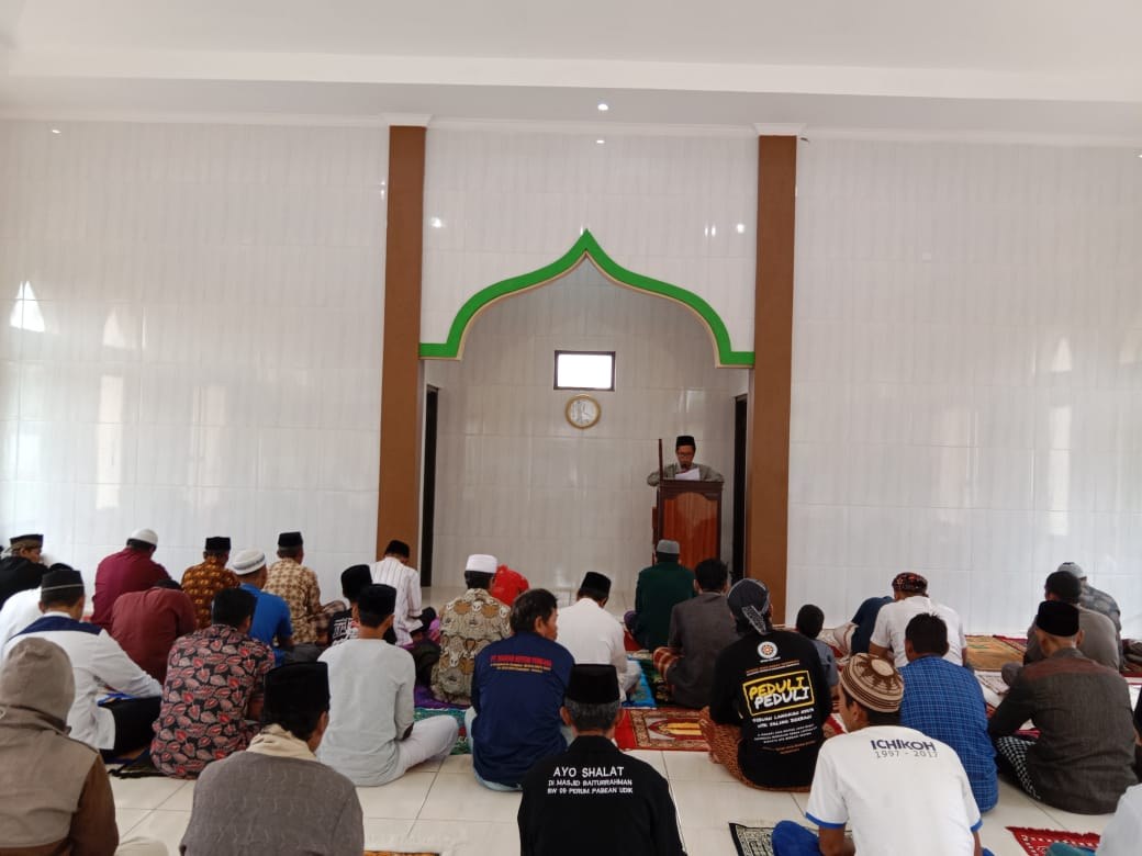 Worshippers gather inside the mosque prayer hall.