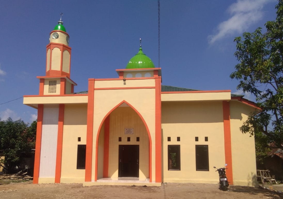 Exterior of the mosque, showing its entrance and windows.