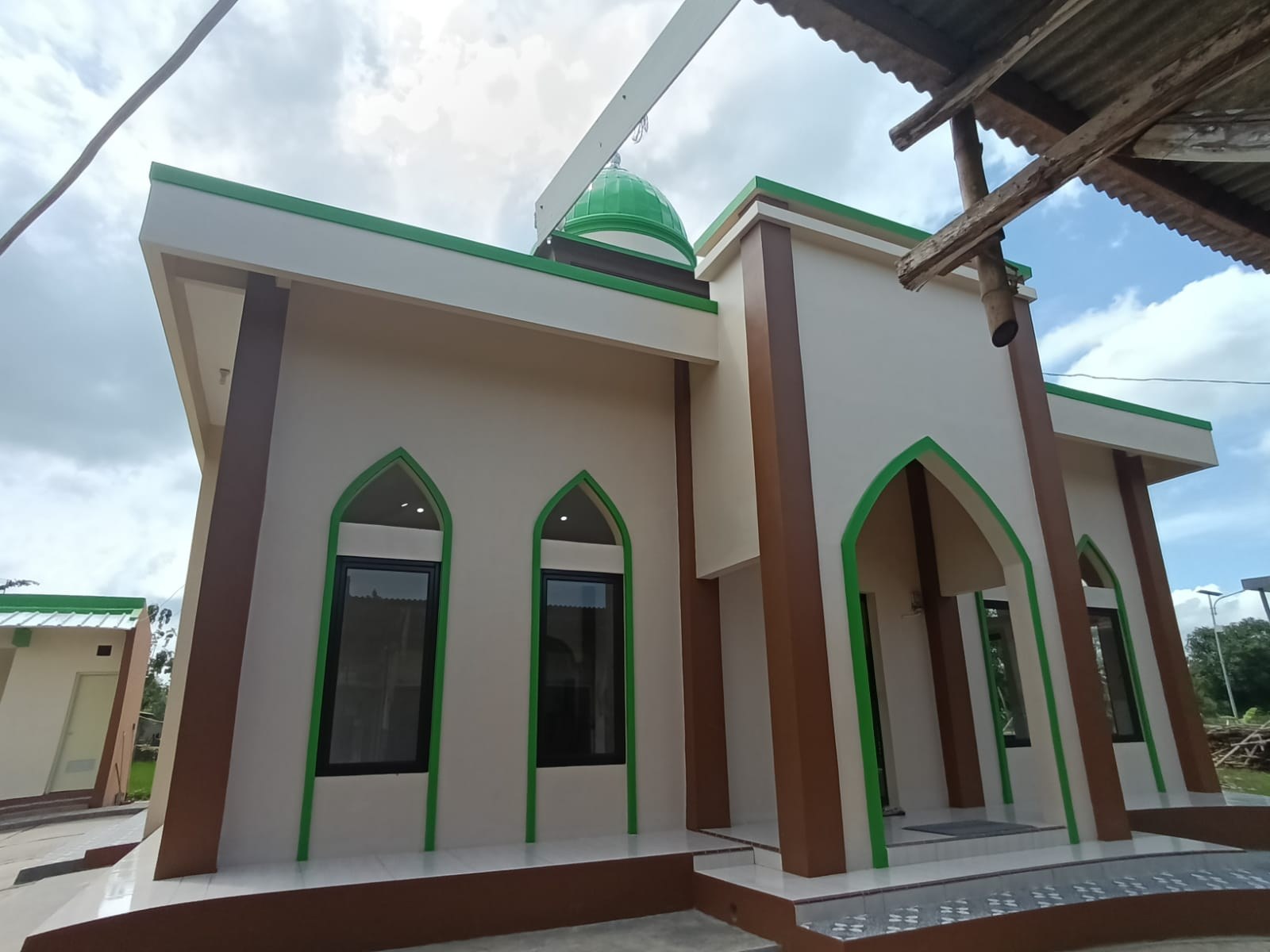 Exterior of the mosque, showing its entrance and windows.
