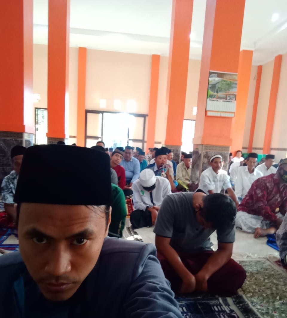 Worshippers gather inside the mosque prayer hall.