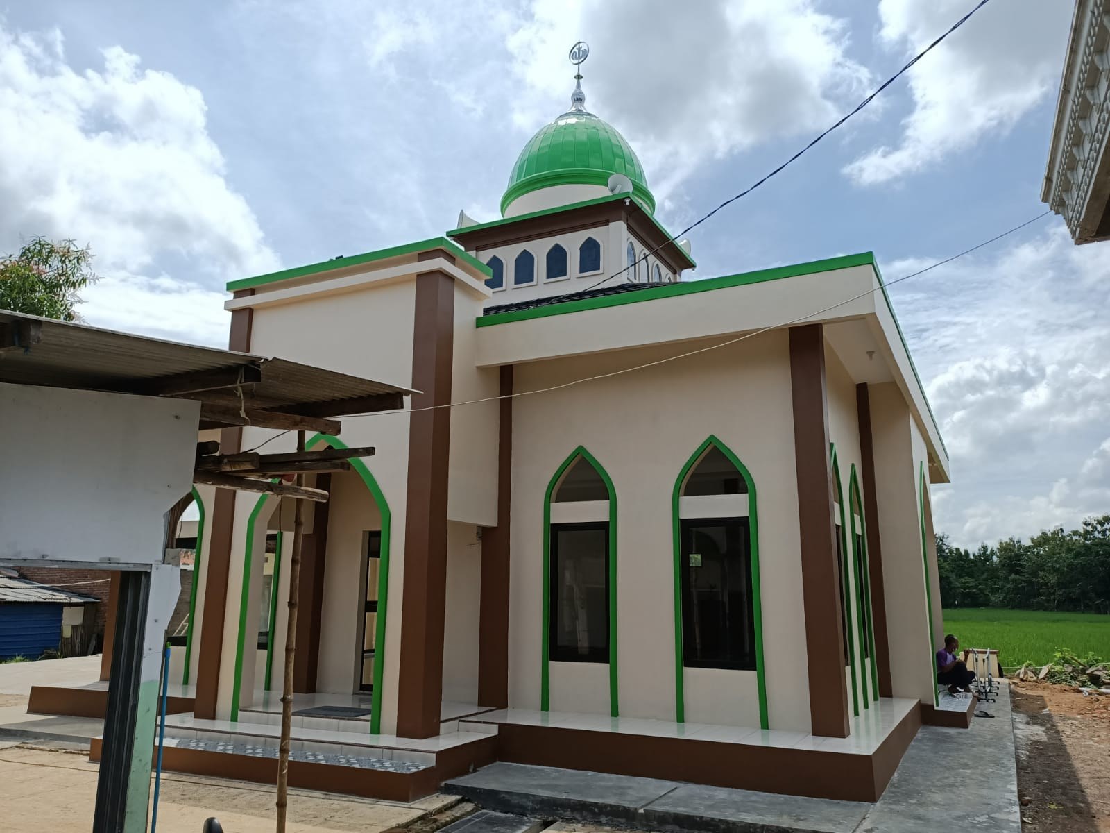 Exterior of the mosque, showing its entrance and windows.