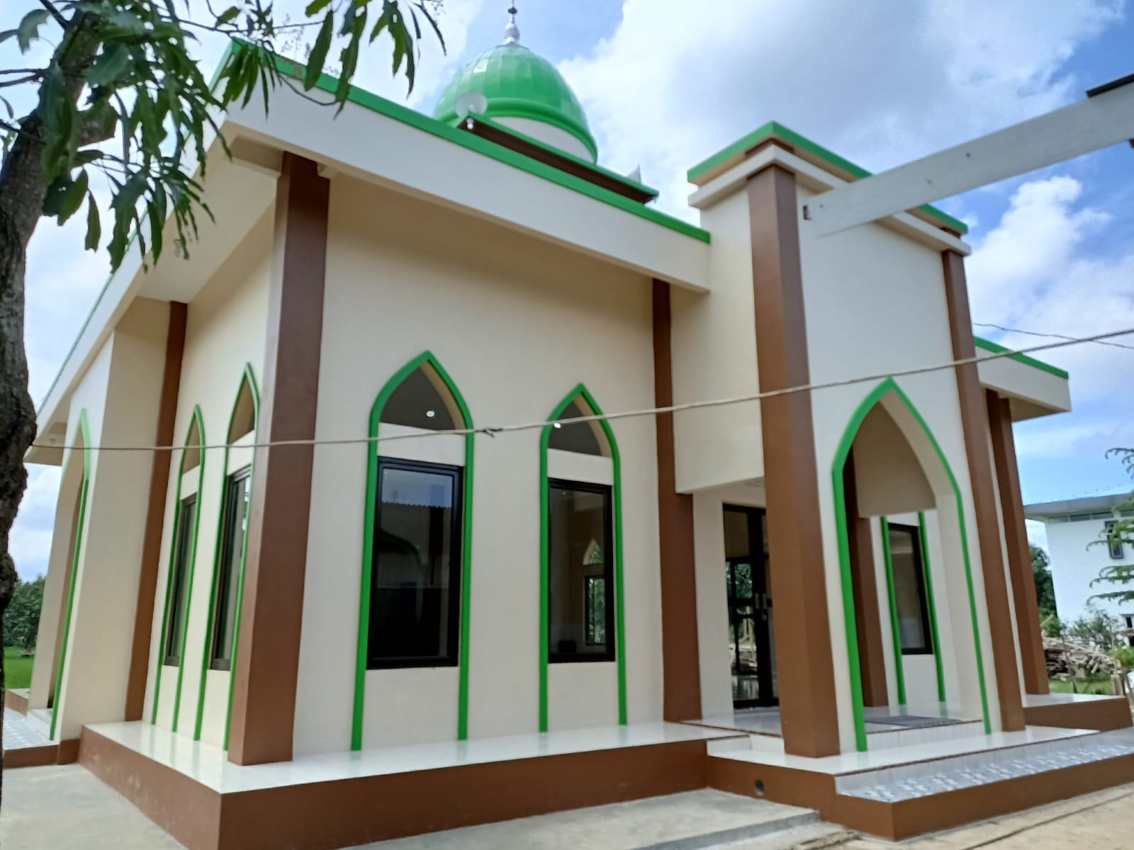 Exterior of the mosque, showing its entrance and windows.