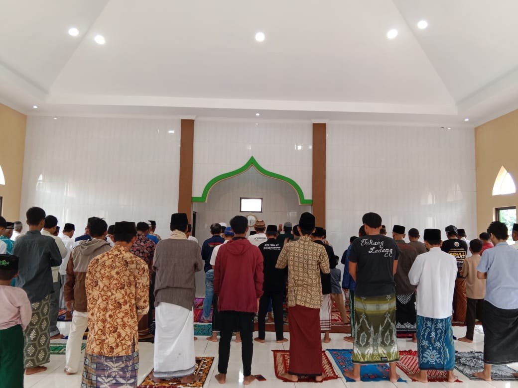 Worshippers gather inside the mosque prayer hall.