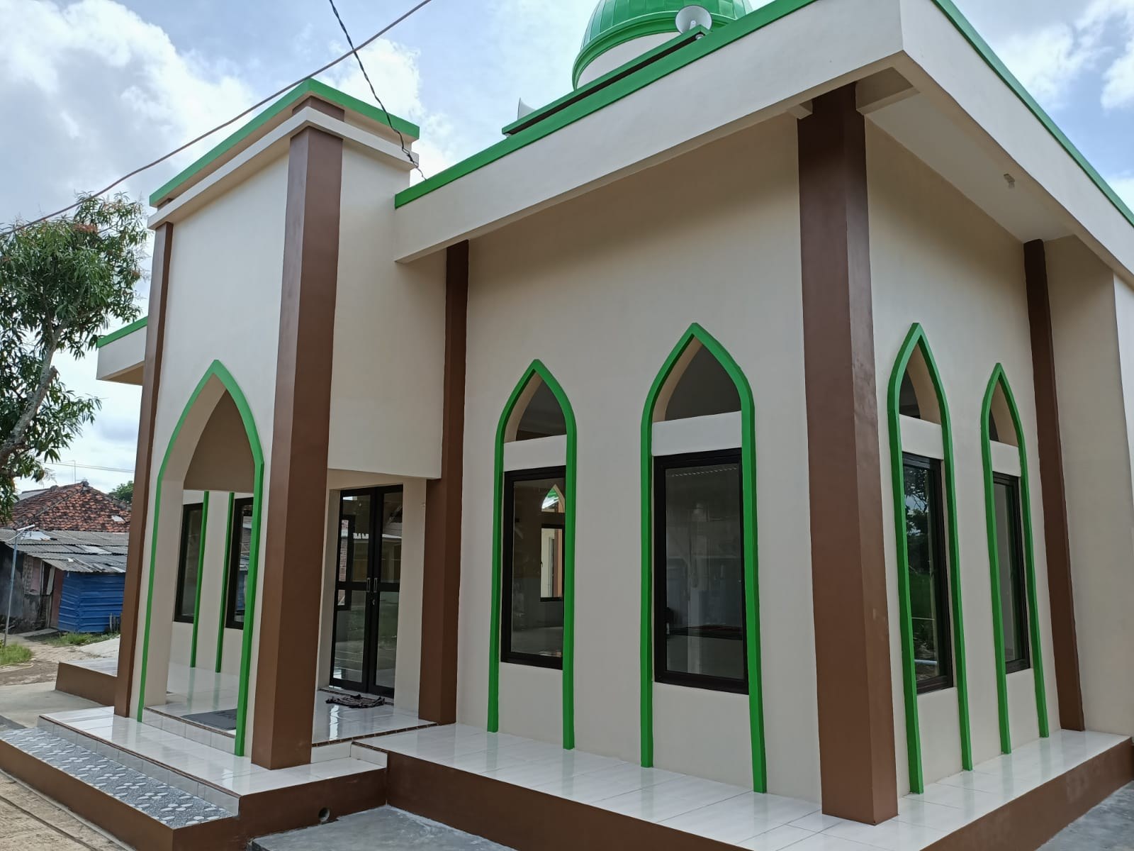 Exterior of the mosque, showing its entrance and windows.