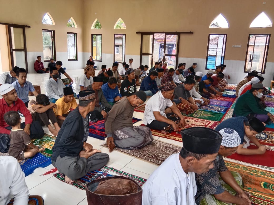 Worshippers gather inside the mosque prayer hall.