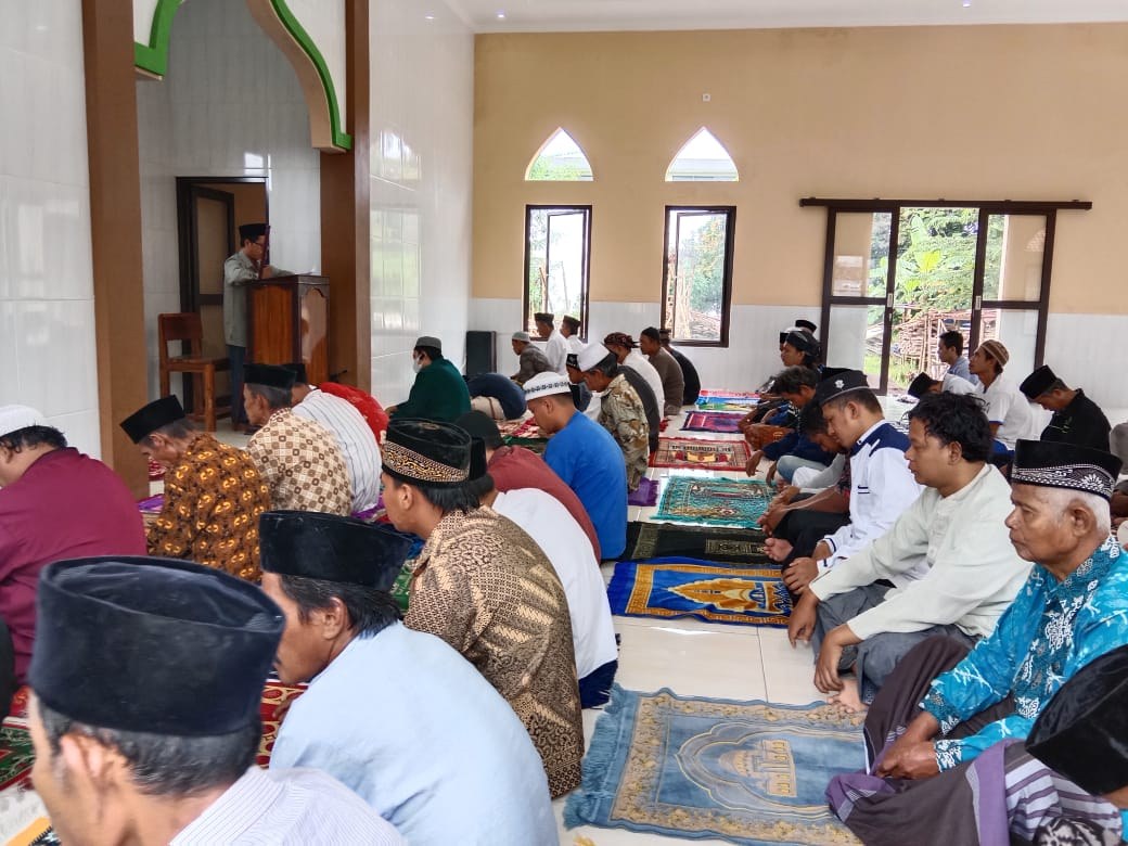 Worshippers gather inside the mosque prayer hall.