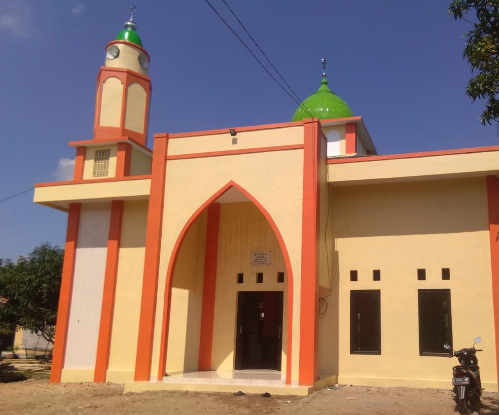 Exterior of the mosque, showing its entrance and windows.